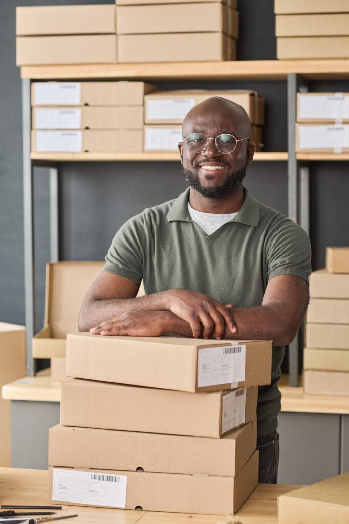 Warehouse worker distributing parcels in warehouse